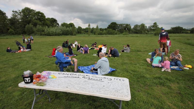Many families enjoying a finish line picnic
