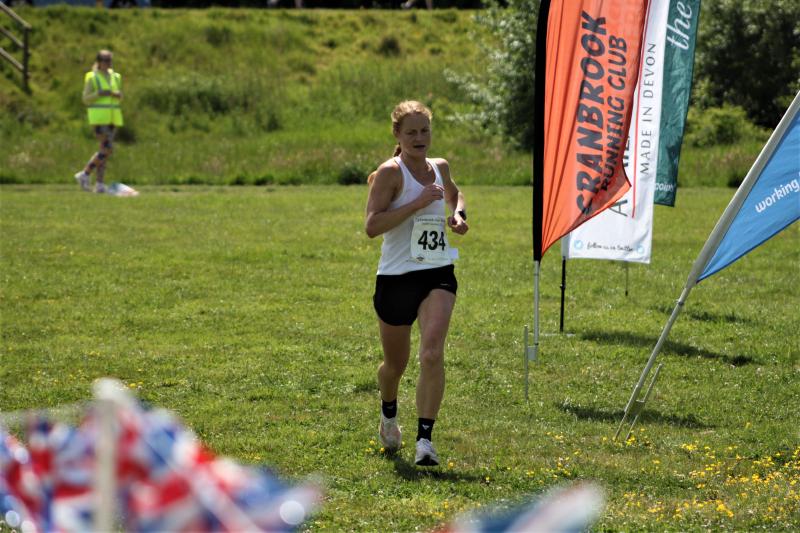 Ann Whittaker crossing the finish line