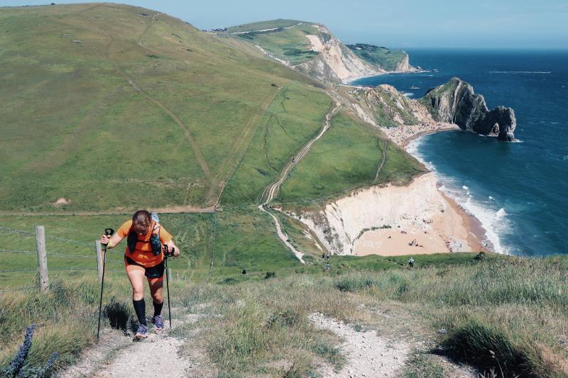 Sarah Adams running along the Jurassic Coast.